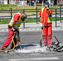 Men are working at the road construction