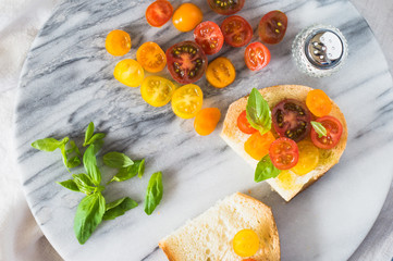 Bruschetta with a Mix of Red, Orange and Yellow Cherry Tomatoes
