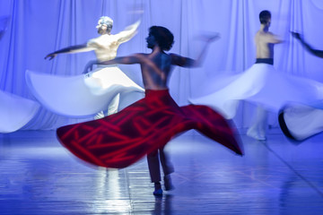 Group of contemporary dancers performing on stage