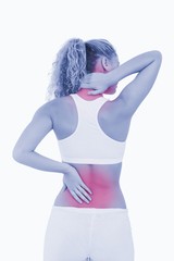 Blonde woman showing pain in her back and in her neck