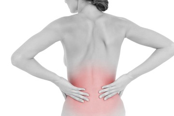 Fototapeta premium Rear view of a fit topless woman with back pain