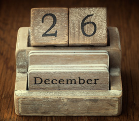 A very old wooden vintage calendar showing the date of 26th Dece
