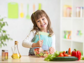 kid girl preparing healthy food