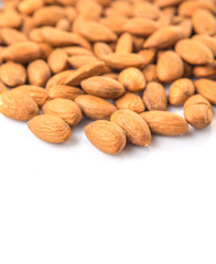 Raw almond nut over white background