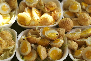 fried quail eggs in asia market