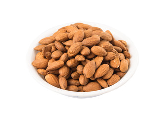 Raw almond nut in a white bowl over white background