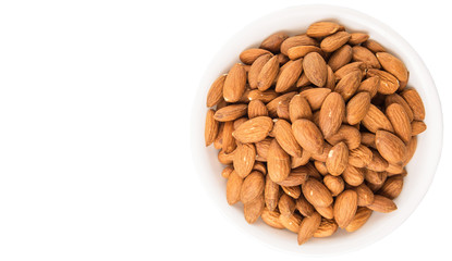 Raw almond nut in a white bowl over white background