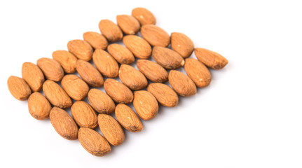 Raw almond nut over white background