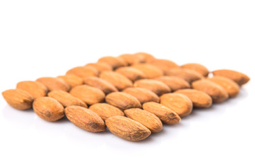 Raw almond nut over white background