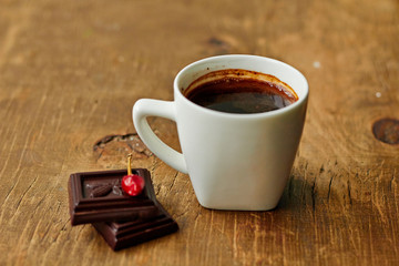 Cup of coffee,dark chocolate and  hot pepper