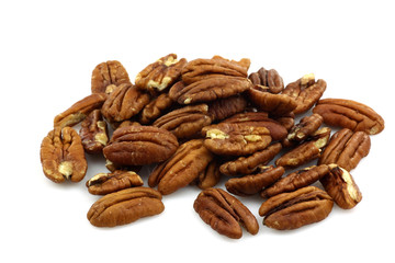 bunch of pecan nuts on a white background