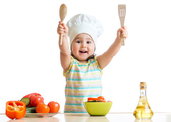 Smiling little cook with ladle, isolated on white