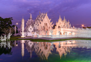 Twilight of magnificent famous temple (Wat Rong Khun ) in Chiang