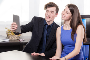 Business man show something on the tablet