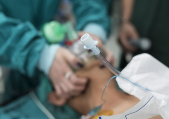 anesthesiologist doctor hold oxygen mask and prepare for intubat