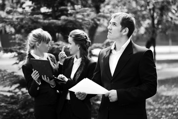 Young business people in a city park