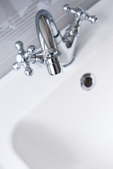 Steel faucet in a bathroom