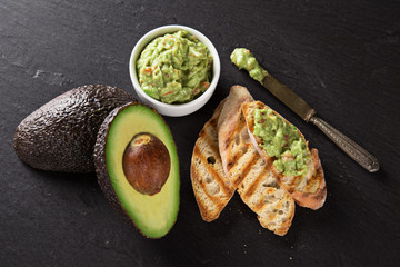 Guacamole with bread and avocado