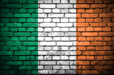 Brick wall with painted flag of Ireland