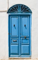 Blue doors and white wall of building in Sidi Bou Said, Tunisia