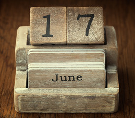 A very old wooden vintage calendar showing the date 17th June on