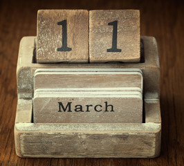 A very old wooden vintage calendar showing the date 11th March o