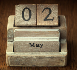 A very old wooden vintage calendar showing the date 2nd May on w