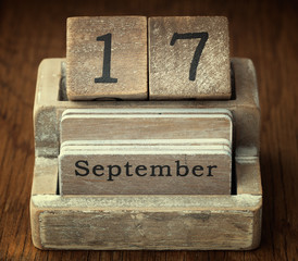 A very old wooden vintage calendar showing the date 17th Septemb