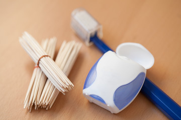 toothpicks, dental floss and toothbrush