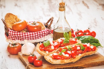 Italian starter, bruschetta with Sicilian red fresh tomato and m