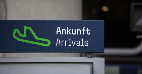 german english plain arrival sign