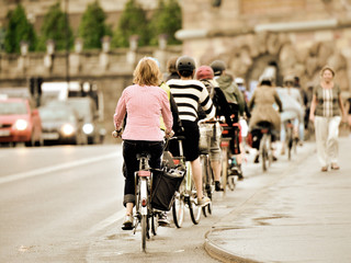 Bicycles in evening traffic.