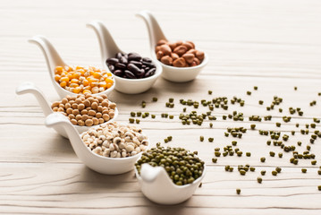 collection set of beans, legumes, peas, lentils on ceramic spoon