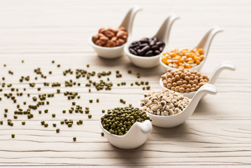 collection set of beans, legumes, peas, lentils on ceramic spoon