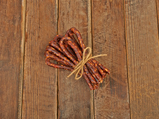 Dry sausage hunting on a wooden table