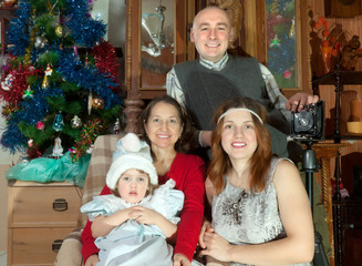   family posing for Christmas portrait