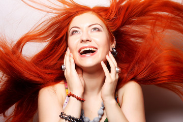 happy woman with long flowing red hair