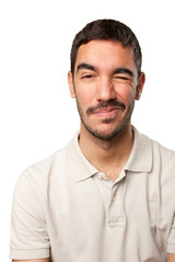 Obraz premium Young man winking an eye