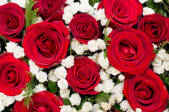 Bouquet of red roses and white flower in Heart shaped Box