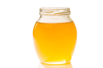 an image of jar of honey isolated on white background