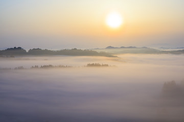 Obraz na płótnie Canvas Sunrise from sea of clouds