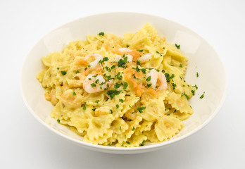 italian pasta called butterflies with shrimp salmon and basil