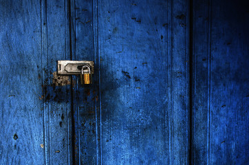 Blue door lock with key.