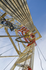 Drilling rig against the blue sky