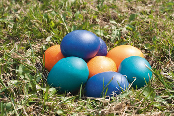 Fototapeta na wymiar Some colored Easter eggs on the green lawn