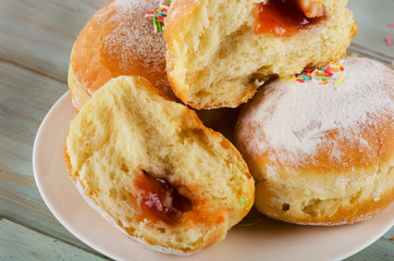 Homemade donuts on a wooden Table.