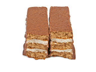 The broken pieces of chocolate biscuit isolated on white