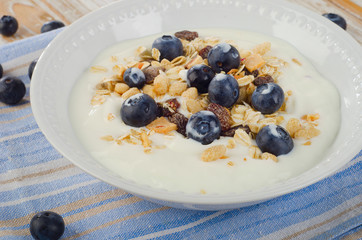 Healthy breakfast - yogurt with blueberries and muesli