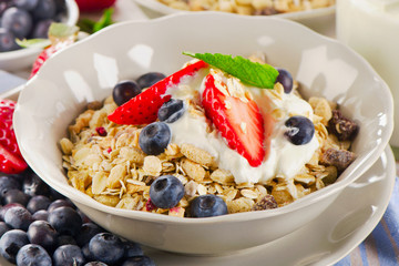Healthy Breakfast with  berries, yogurt , muesli.