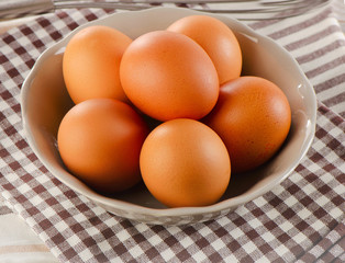 Fresh raw   brown eggs in  bowl